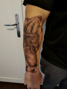 View Wolf on forearm by Tom Wood